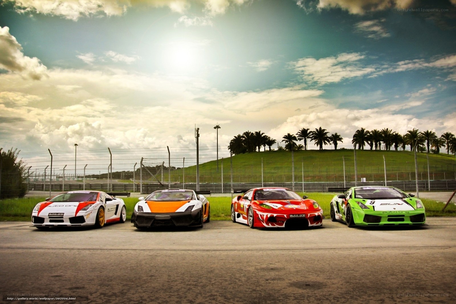 Four race cars on a track