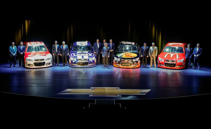 Four Race Cars on Stage