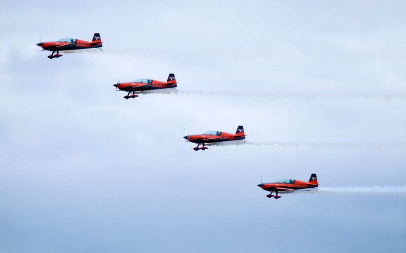 Four Red Aerobatic Planes