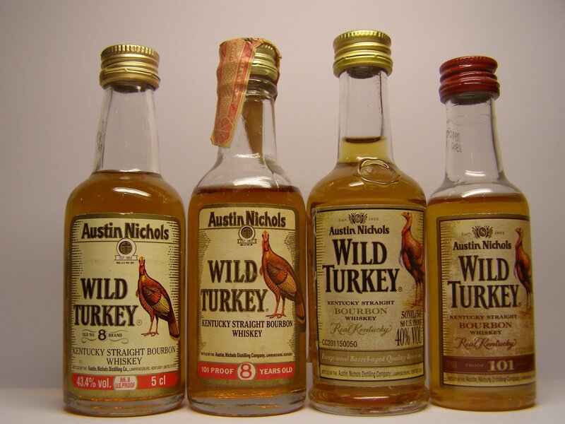 Four Wild Turkey bourbon bottles