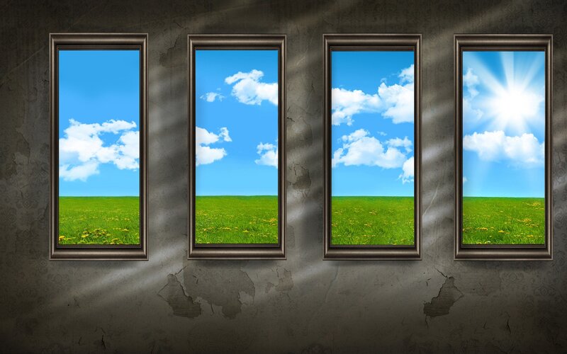 Four windows to a green field