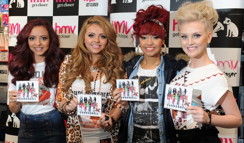 Four Women Holding Albums