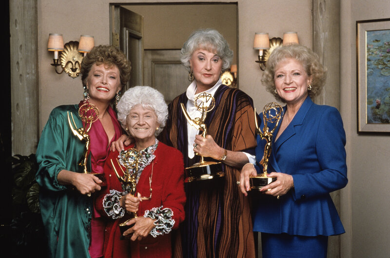 Four Women Holding Awards