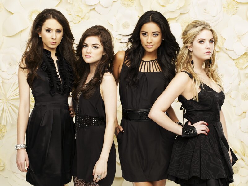 four women in black dresses
