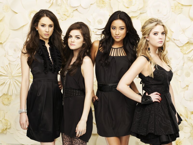 four women in black dresses