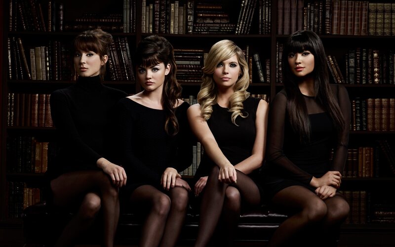 four women in black dresses