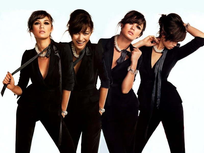 Four Women in Black Suits