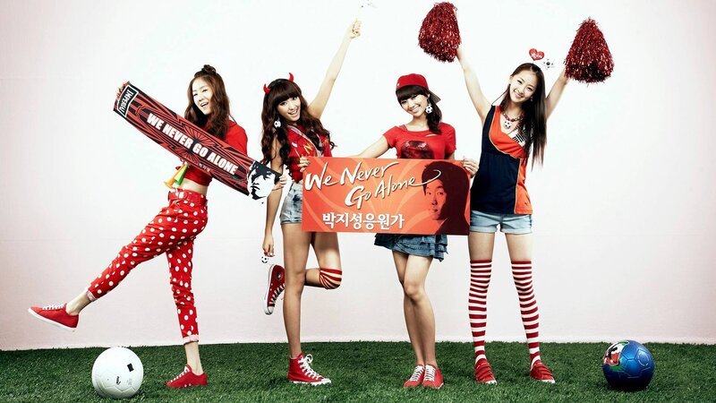 Four Women in Cheerleading Outfits