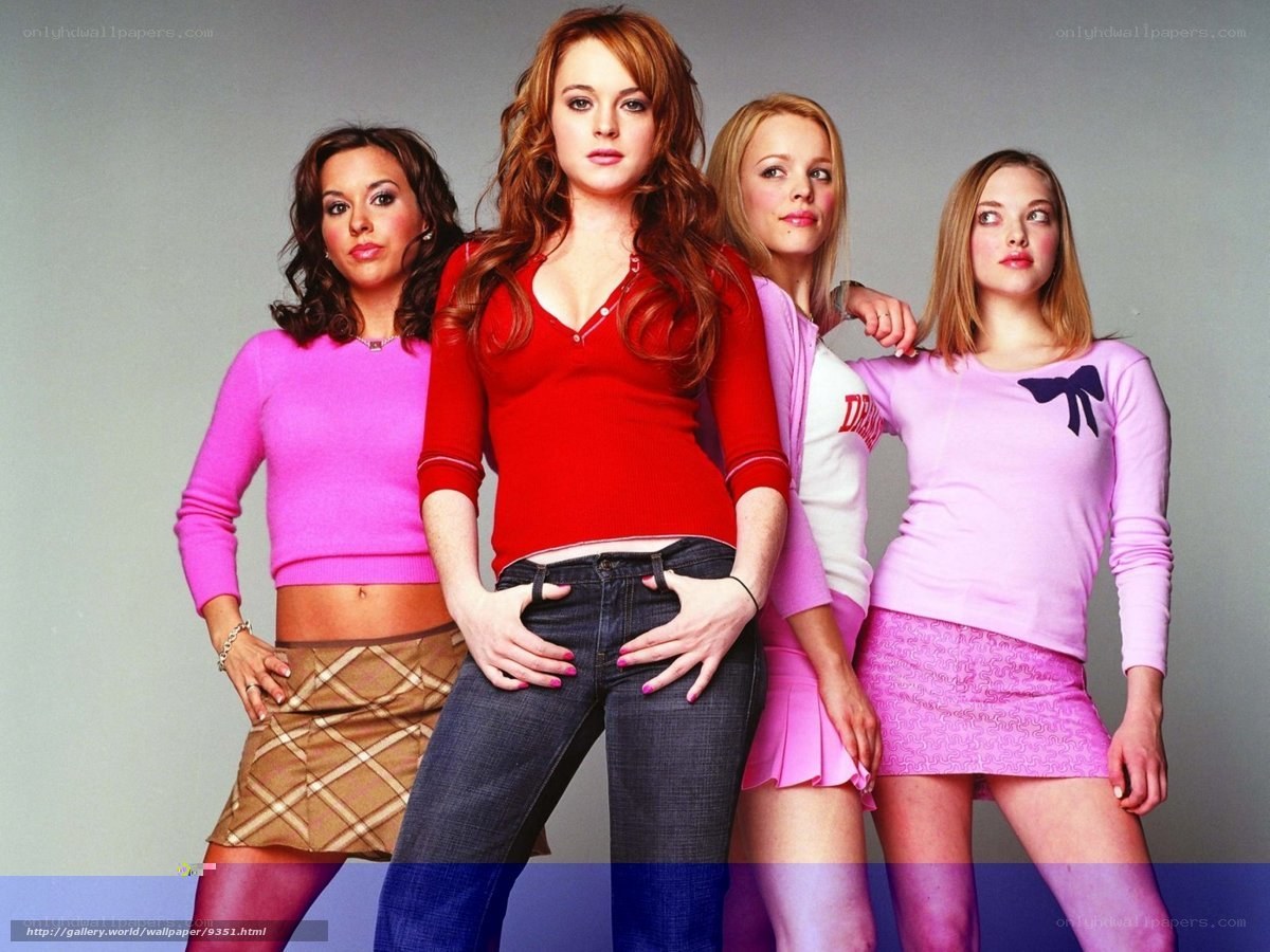 four women in colorful outfits