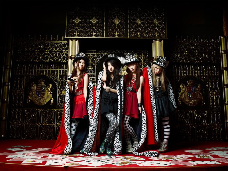 Four Women in Costumes — Black, Dramatic