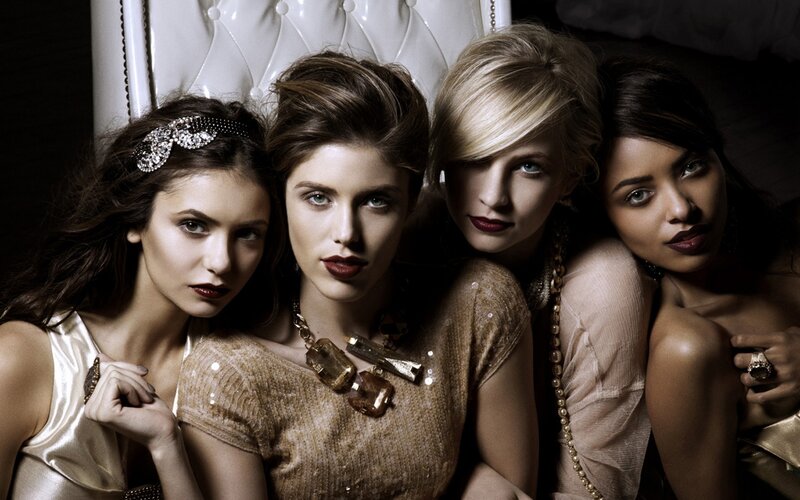 four women in elegant attire