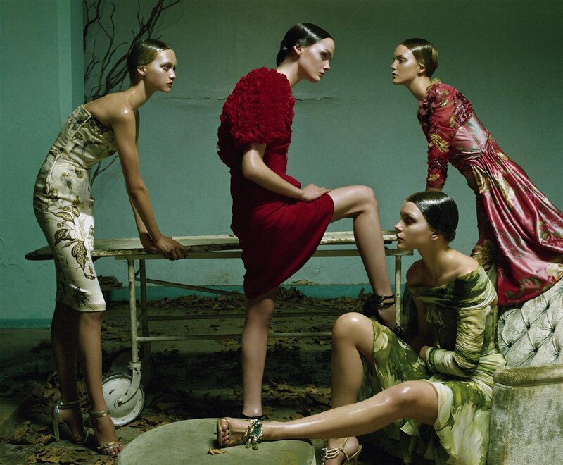 Four women in elegant dresses
