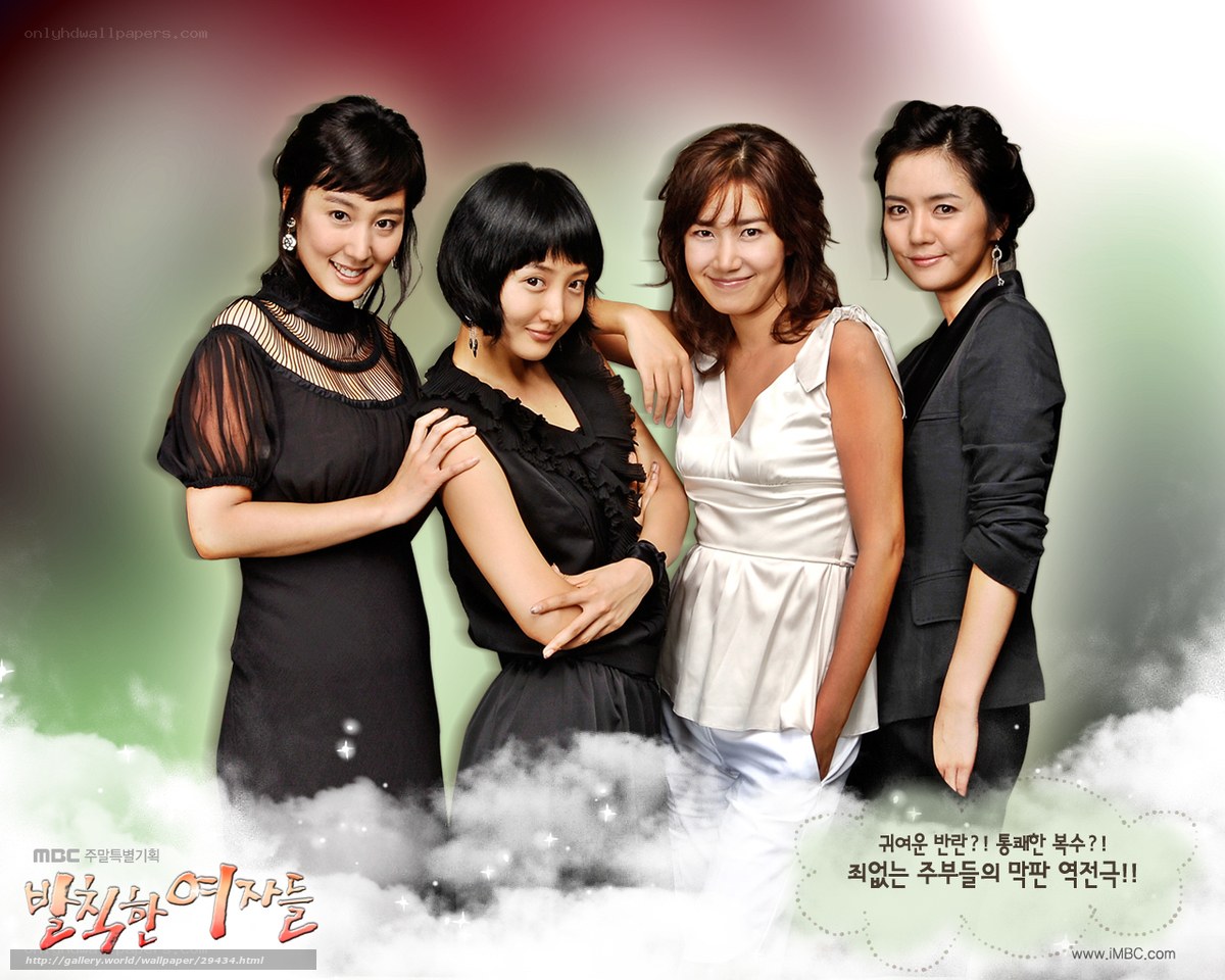 Four women in elegant dresses
