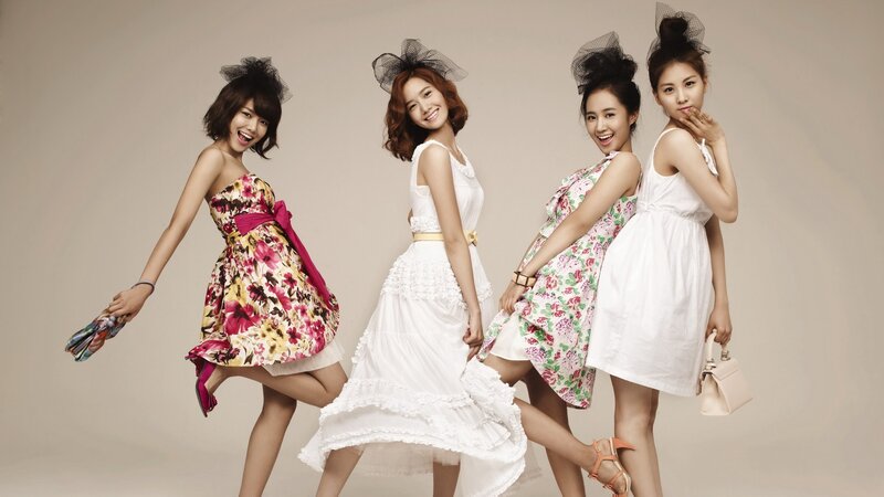 four women in floral dresses