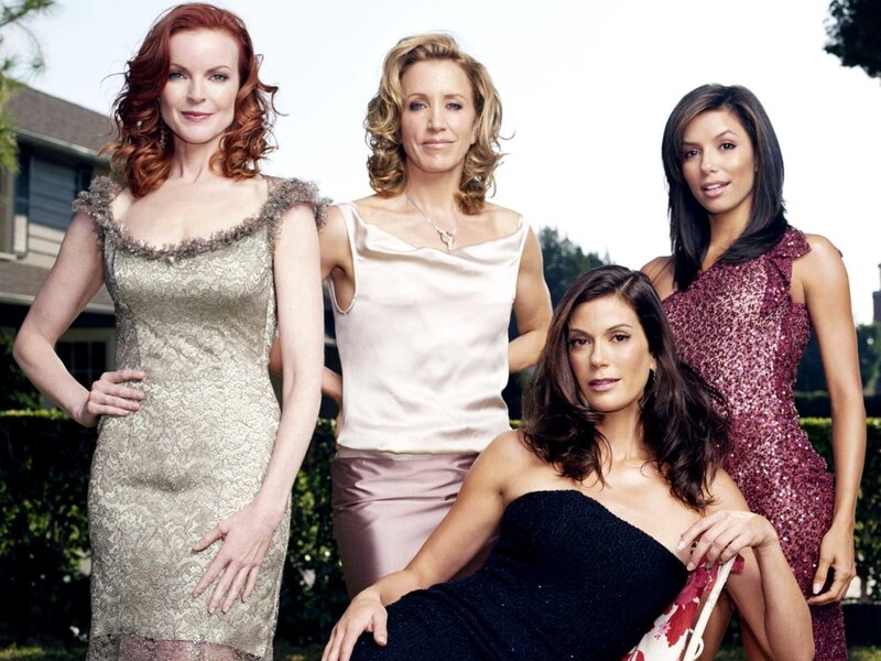 Four women in formal dresses