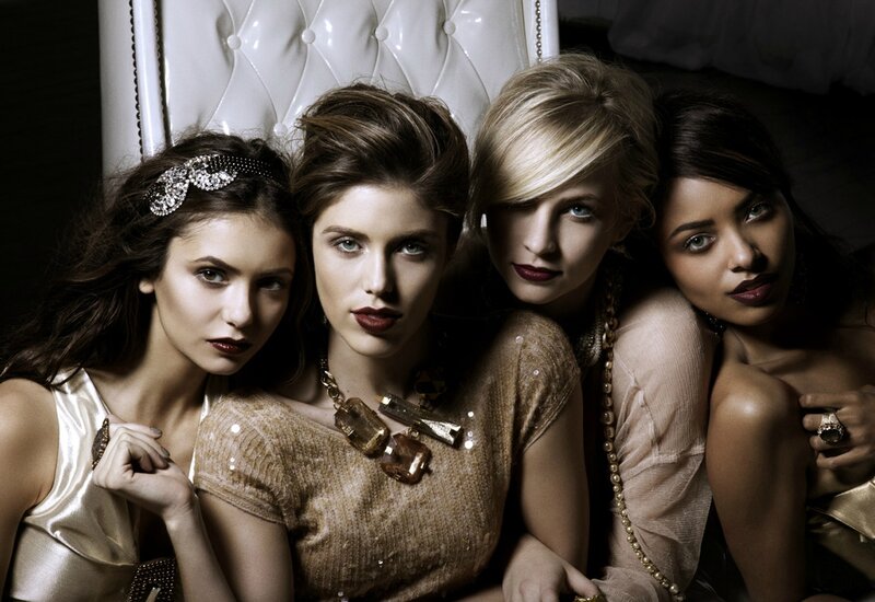 Four Women in Gold Outfits