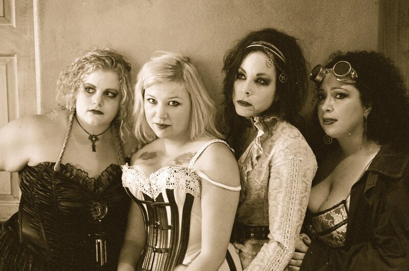 four women in gothic attire