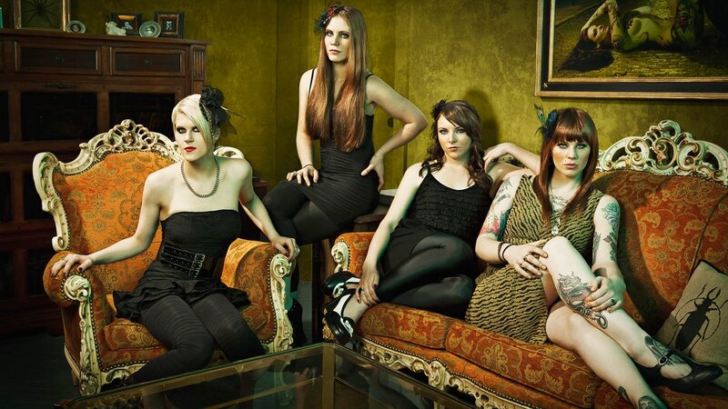 four women in gothic attire