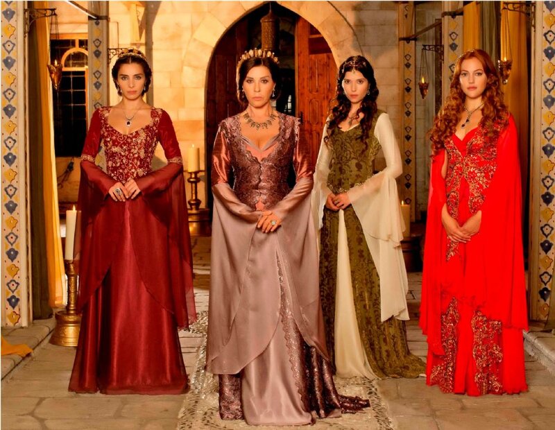 Four Women in Historical Dresses