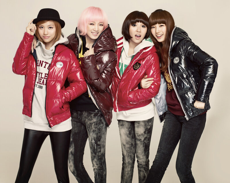 four women in puffer jackets