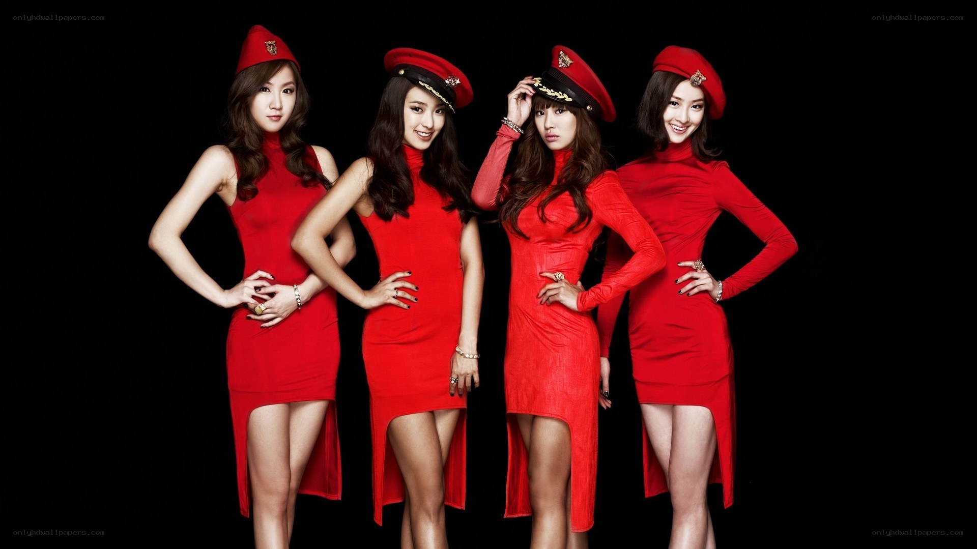 four women in red outfits