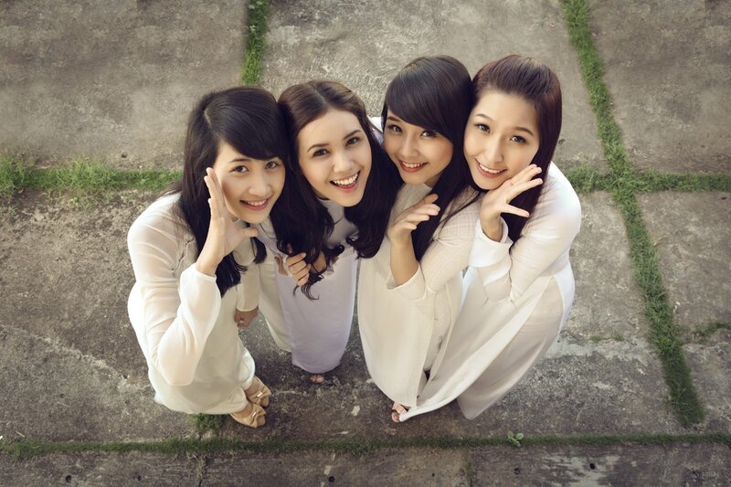 Four women in traditional dresses