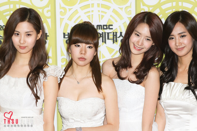 four women in white dresses