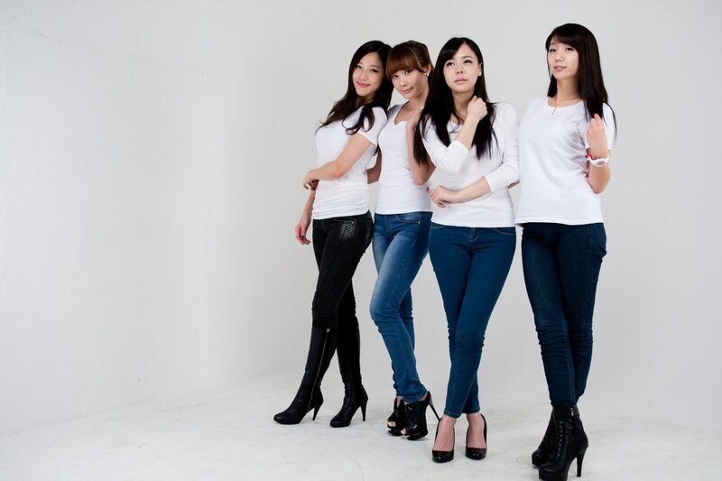 four women in white shirts
