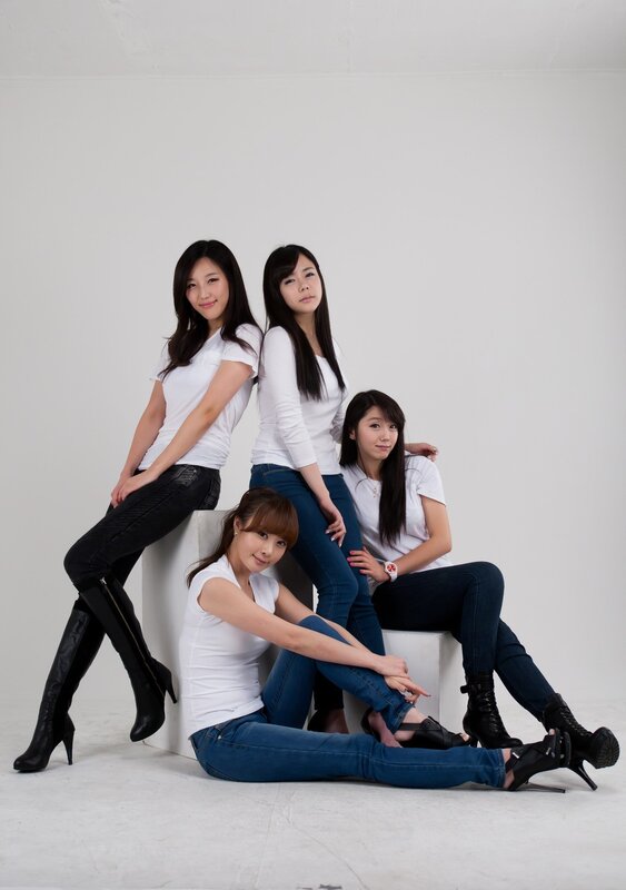 four women in white shirts