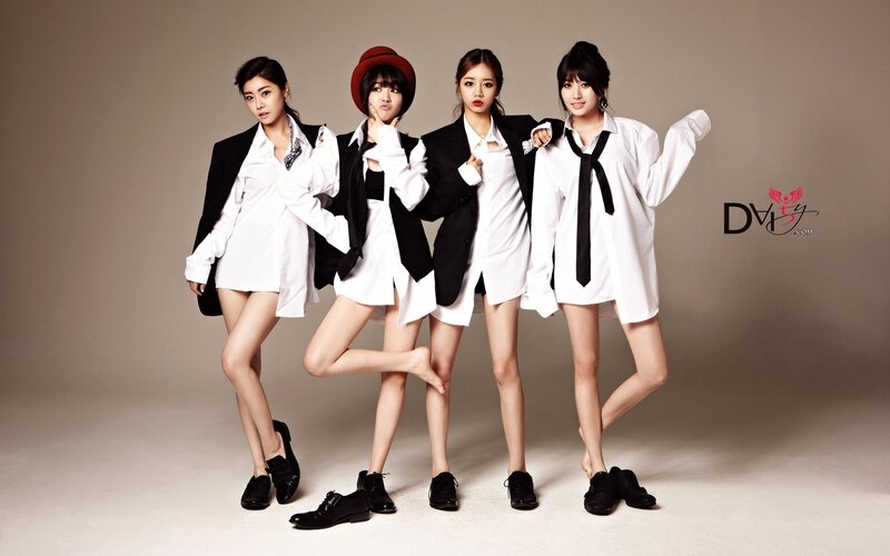 four women in white shirts and black blazers