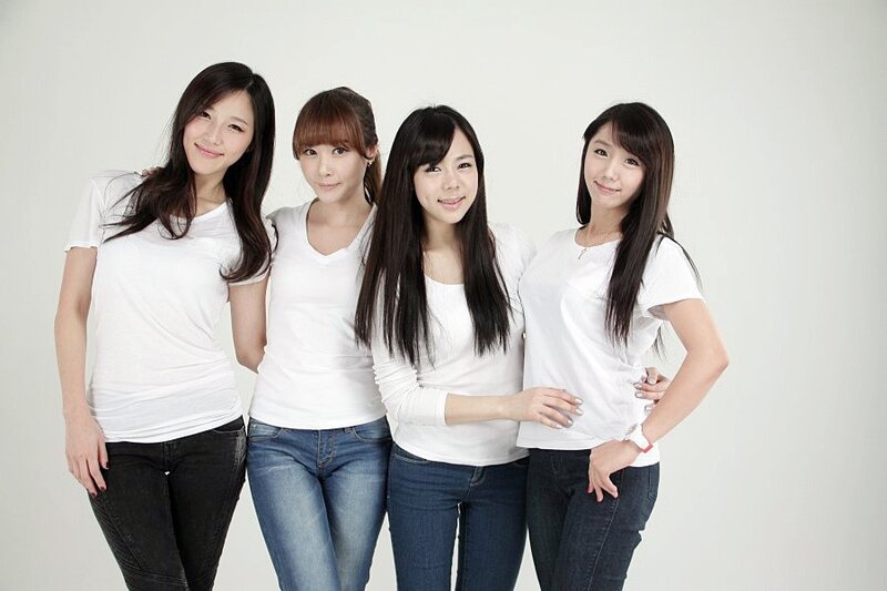 four women in white shirts