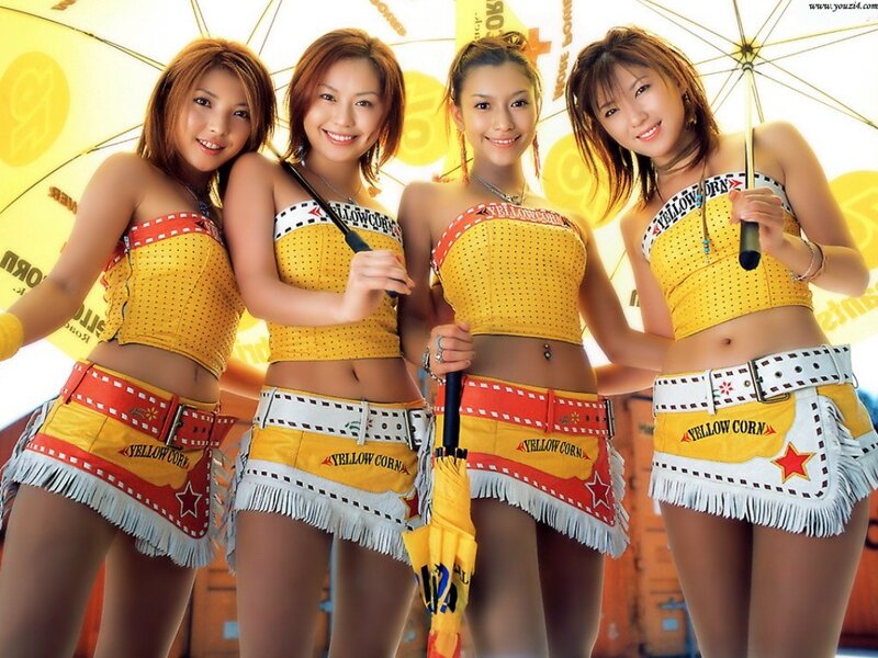four women in yellow corn outfits