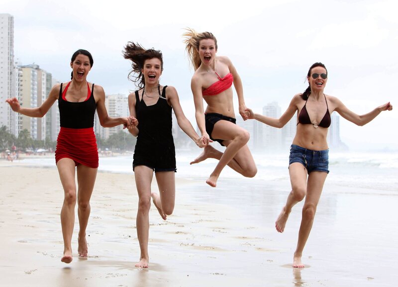 Four Women on Beach — White, Joyful