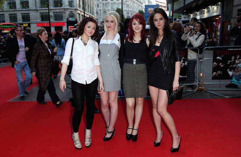 four women on red carpet