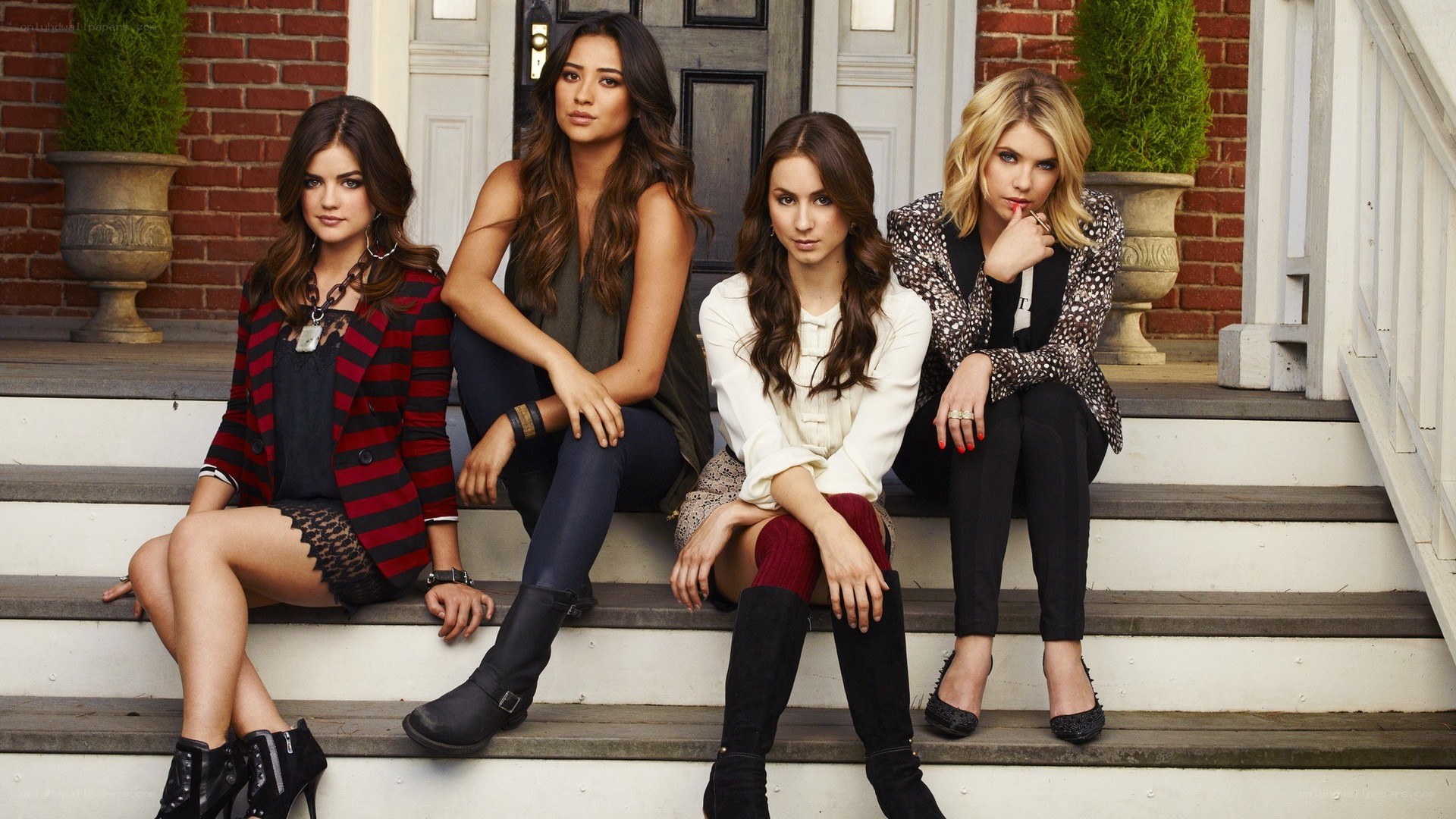 four women on steps