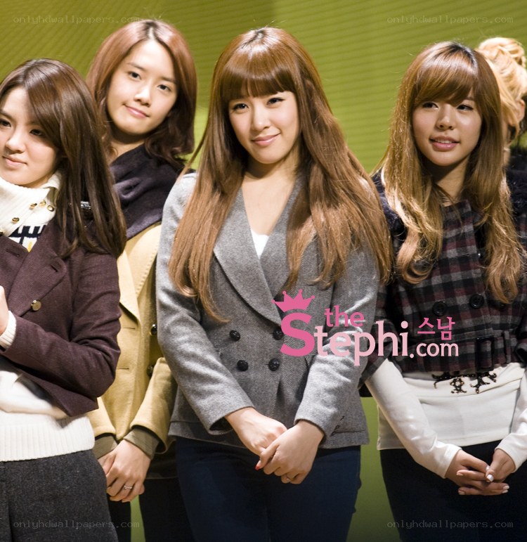 four women posing together
