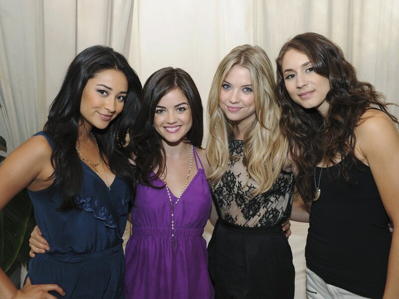 Four Women Posing Together — Purple