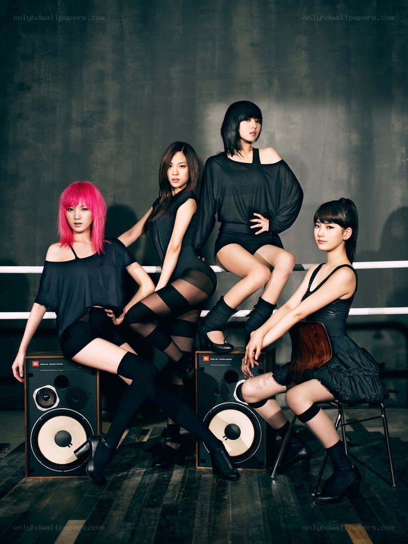 four women posing with speakers