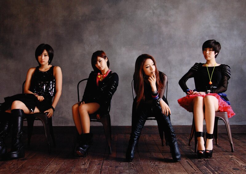 Four Women Sitting on Chairs