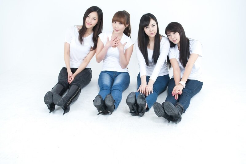 four women sitting on floor