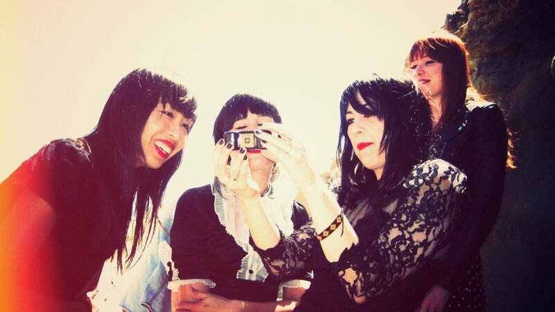 four women taking a photo