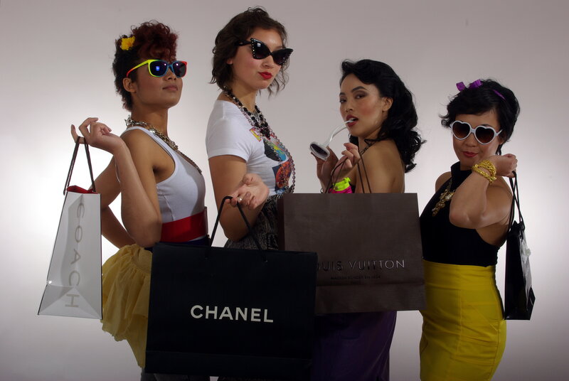 Four women with shopping bags