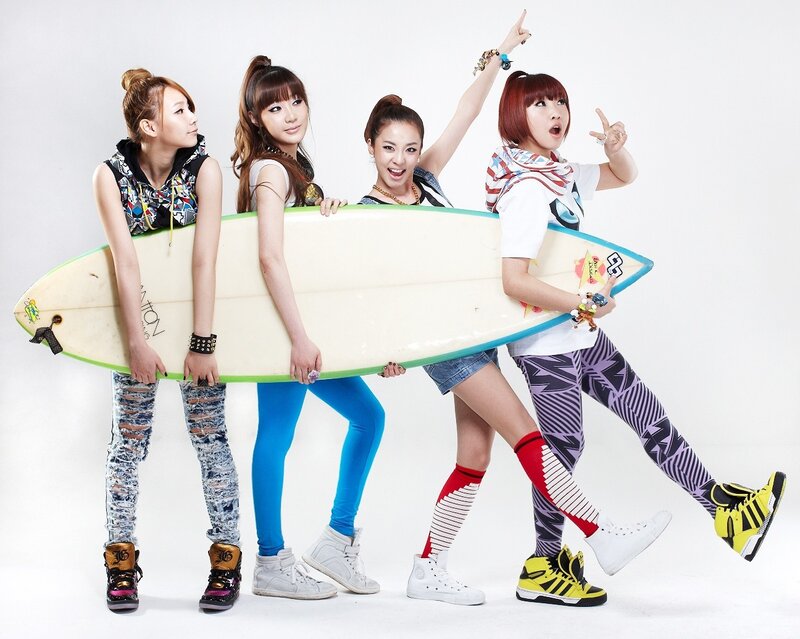 four women with surfboard