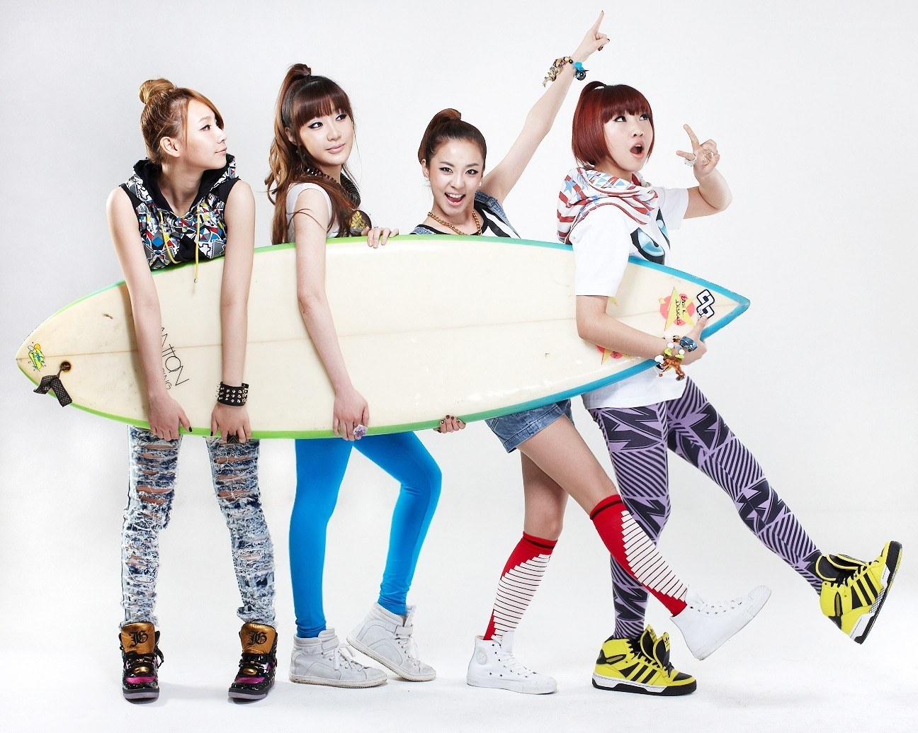 four women with surfboard