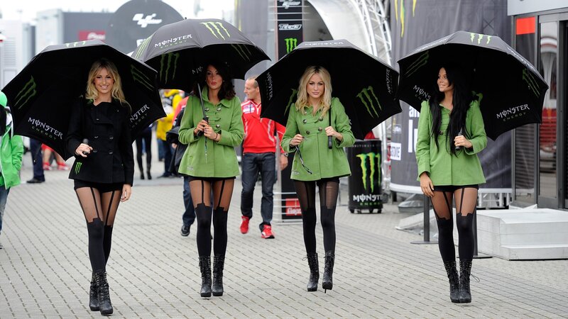 Four Women with Umbrellas