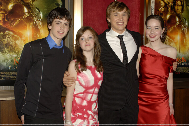 Four young actors at a movie premiere