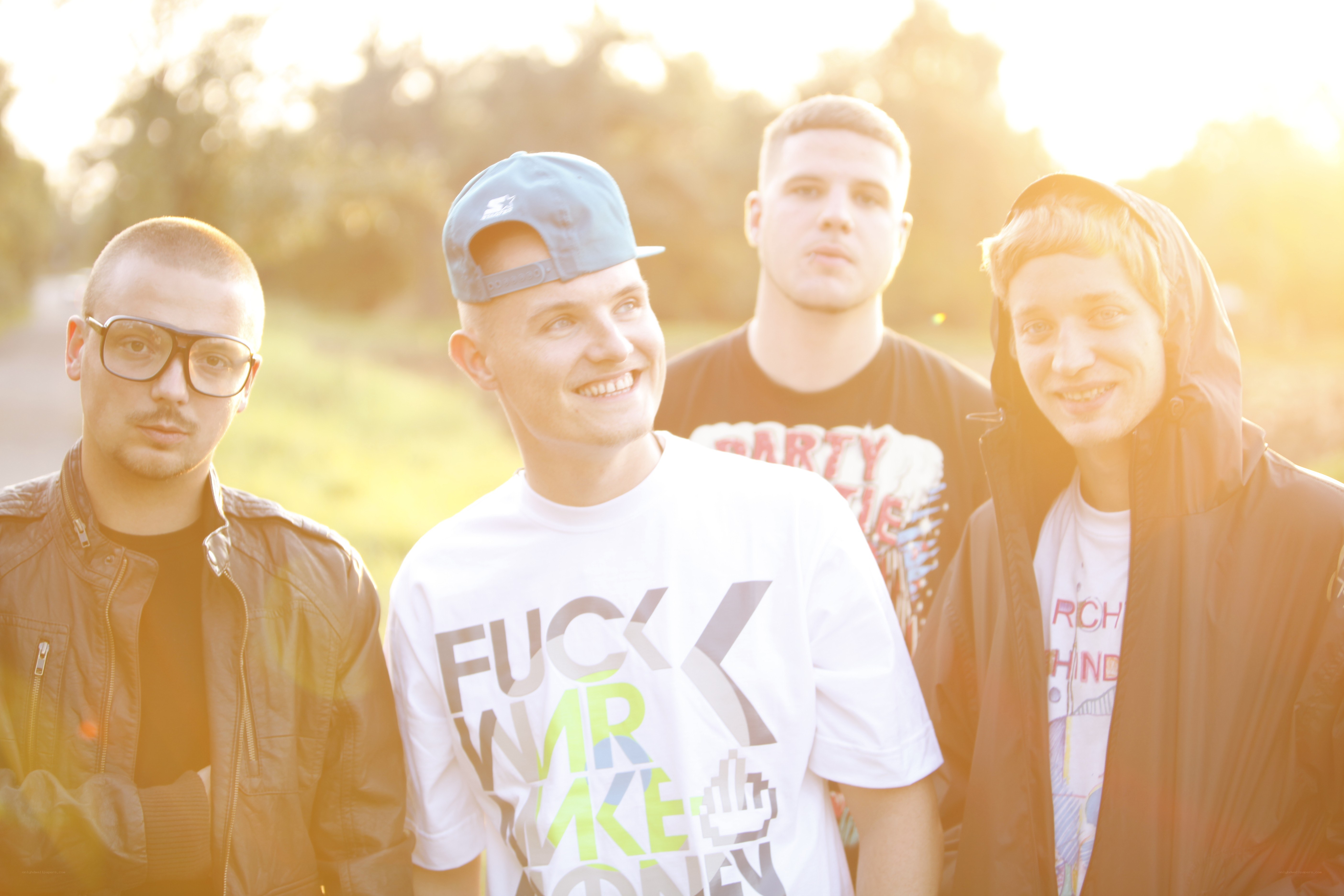 four young men in a park