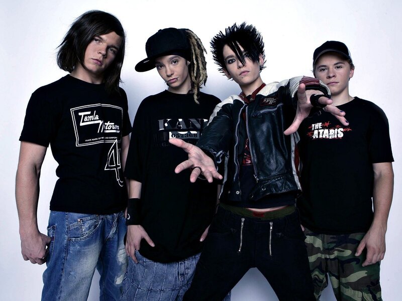 four young men in band attire