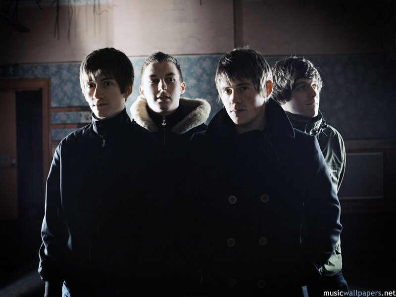 Four Young Men in Coats