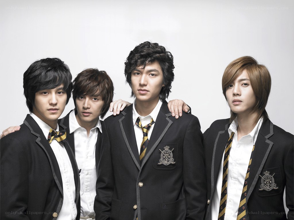 four young men in school uniforms